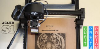 Acmer S1 6W laser engraver on a wooden workbench, engraving a tiger head