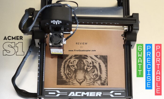 Acmer S1 6W laser engraver on a wooden workbench, engraving a tiger head