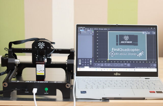 Acmer S1 laser engraver connected to a laptop running LaserGRBL control software.