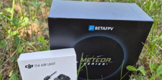 BetaFPV Meteor75 Pro O4 micro drone on display with prop guards and HD camera, set against a clean background.