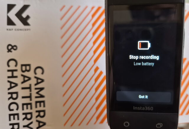 Close-up of an Insta360 X4 camera screen displaying a recording stop message due to low battery at 5%.