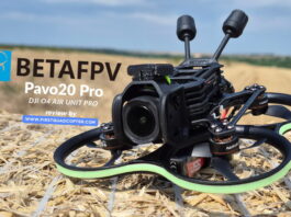 BetaFPV Pavo20 Pro O4 Pro cinewhoop drone equipped with DJI O4 Air Unit, shown on a hay bale ready for flight.