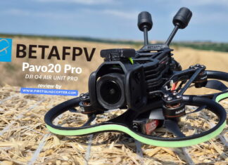 BetaFPV Pavo20 Pro O4 Pro cinewhoop drone equipped with DJI O4 Air Unit, shown on a hay bale ready for flight.