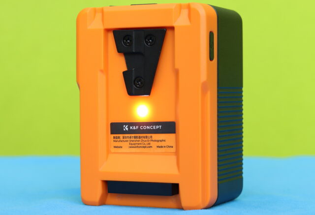 Back view of the K&F Concept V-Mount battery showing the V-mount connector and built-in LED light for use in a backpack