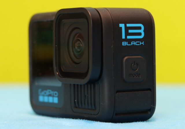 Close-up of the GoPro Hero 13 Black Mode-Power button on the side of the camera, showing the textured surface and icon detail.