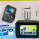 GoPro Hero 13 Review – An Honest Hands-On Test GoPro Hero 13 Black placed on a table during a hands-on review, with accessories and packaging visible in the background.