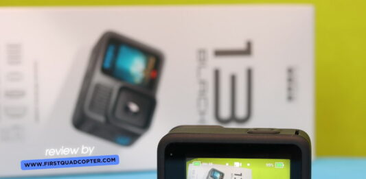 GoPro Hero 13 Black placed on a table during a hands-on review, with accessories and packaging visible in the background.