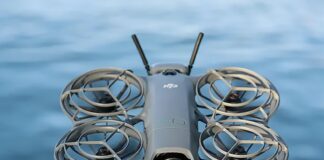 DJI NEO 2 FPV drone with forward-looking LiDAR, upgraded camera, and stabilized gimbal in flight.