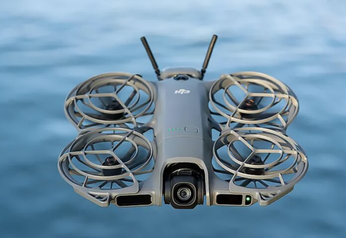 DJI NEO 2 FPV drone with forward-looking LiDAR, upgraded camera, and stabilized gimbal in flight.