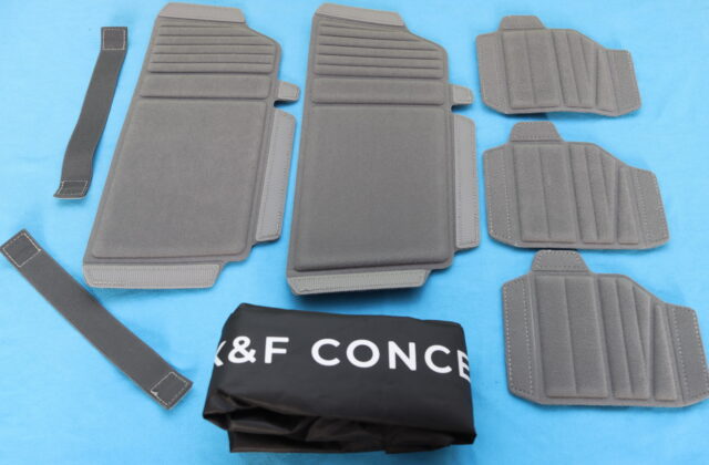 Unboxing the K&F Concept Nature Wander 11 camera backpack with included rain cover and adjustable velcro dividers displayed on the table.