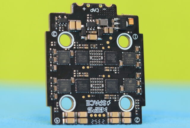 Close-up of the MEPS AeroCore 45A ESC showing its wiring, connectors, and compact design.