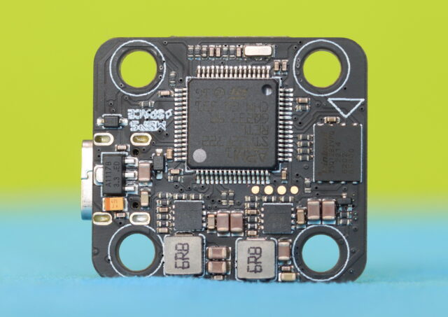 Close-up of the MEPS AeroCore F7 flight controller showing its ports, connectors, and layout.