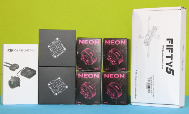 Lightweight LR HD Digital FPV drone components including MEPS AeroCore flight stack, DJI O4 Pro, MEPS 2305 motors, and FlyFish-RC Fifty5 frame, laid out on a table.