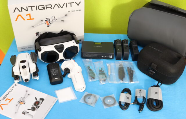 Photo of the Antigravity A1 drone and all contents of the Infinity Bundle laid out during unboxing.