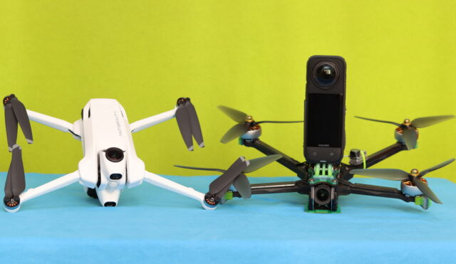 Antigravity A1 drone displayed on a table next to a custom FPV drone with an Insta360 X4 camera