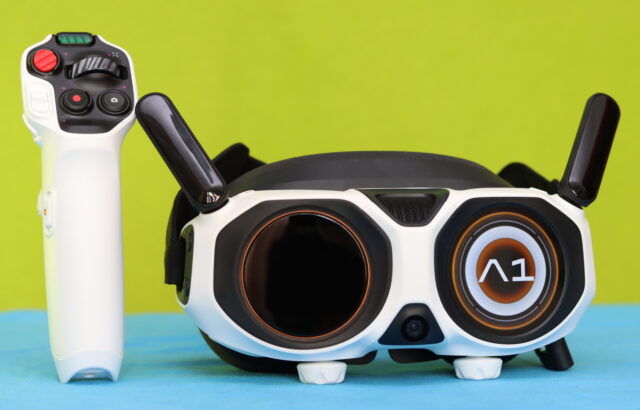 Antigravity Vision Goggles next to the Motion Grip controller on a table