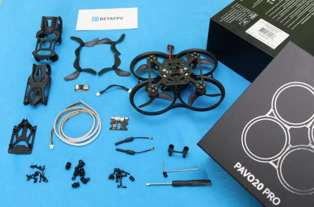 BetaFPV Pavo20 Pro II micro FPV drone and accessories laid out during the unboxing process.