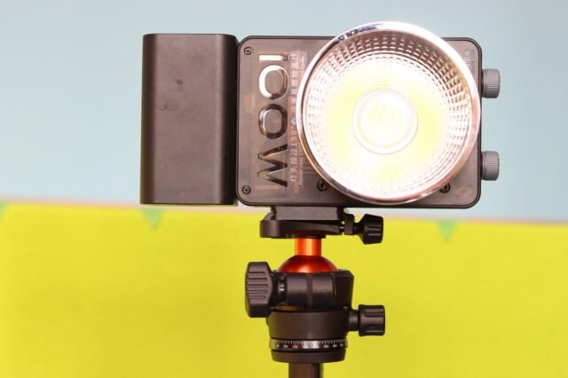 K&F CONCEPT O235A1 tripod used as a video light stand, holding a 100W LED light mounted on top.