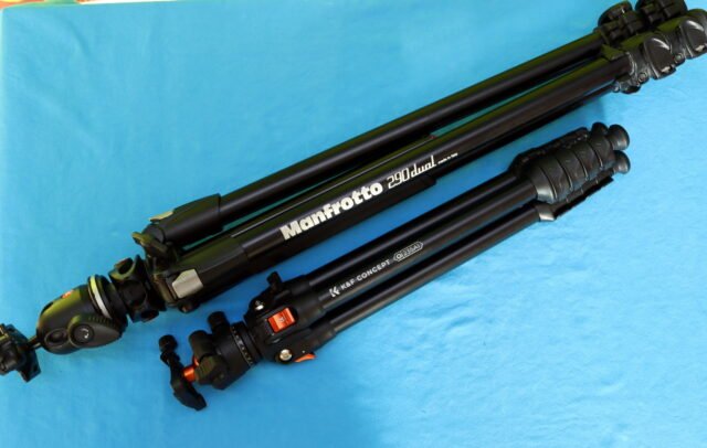 Side-by-side size and leg diameter comparison between the compact K&F CONCEPT O235A1 tripod and the bulkier Manfrotto 290 Dual tripod.
