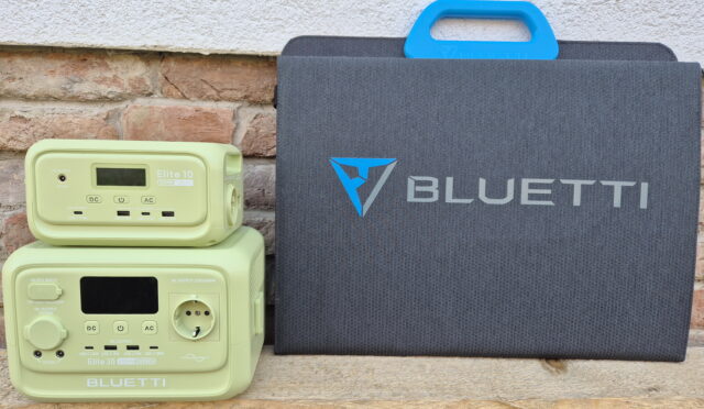 100W solar panel compatible with the Bluetti Elite 10 and Bluetti Elite 30 V2 portable power stations, shown unfolded outdoors with sunlight hitting the panels.