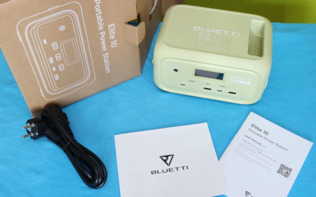 Bluetti Elite 10 portable power station being unboxed on a table, showing the packaging and the device as it is taken out of the box.