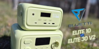 Side‑by‑side comparison of the Bluetti Elite 10 and Bluetti Elite 30 V2 portable power stations on a table with some accessories, showing both units clearly for a review photo.