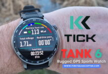 Close-up of the KKTICK Tank T6 smartwatch during a hands-on review showing its rugged design and digital display.