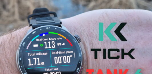 Close-up of the KKTICK Tank T6 smartwatch during a hands-on review showing its rugged design and digital display.