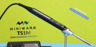 Miniware TS1M ultra-compact 200W USB-C soldering station with active tip handle, OLED display base, and portable design on a workbench