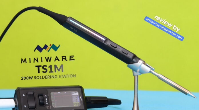 Miniware TS1M ultra-compact 200W USB-C soldering station with active tip handle, OLED display base, and portable design on a workbench