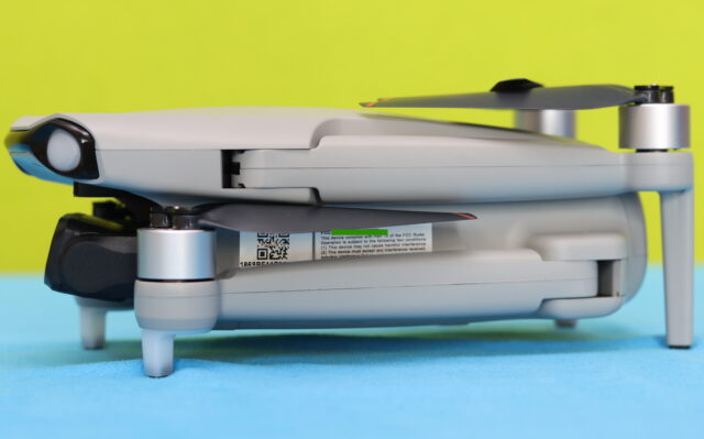 Close-up of the Ruko F11PRO 2 Plus showing the built-in Remote ID QR code and serial number used for FAA registration and compliance.